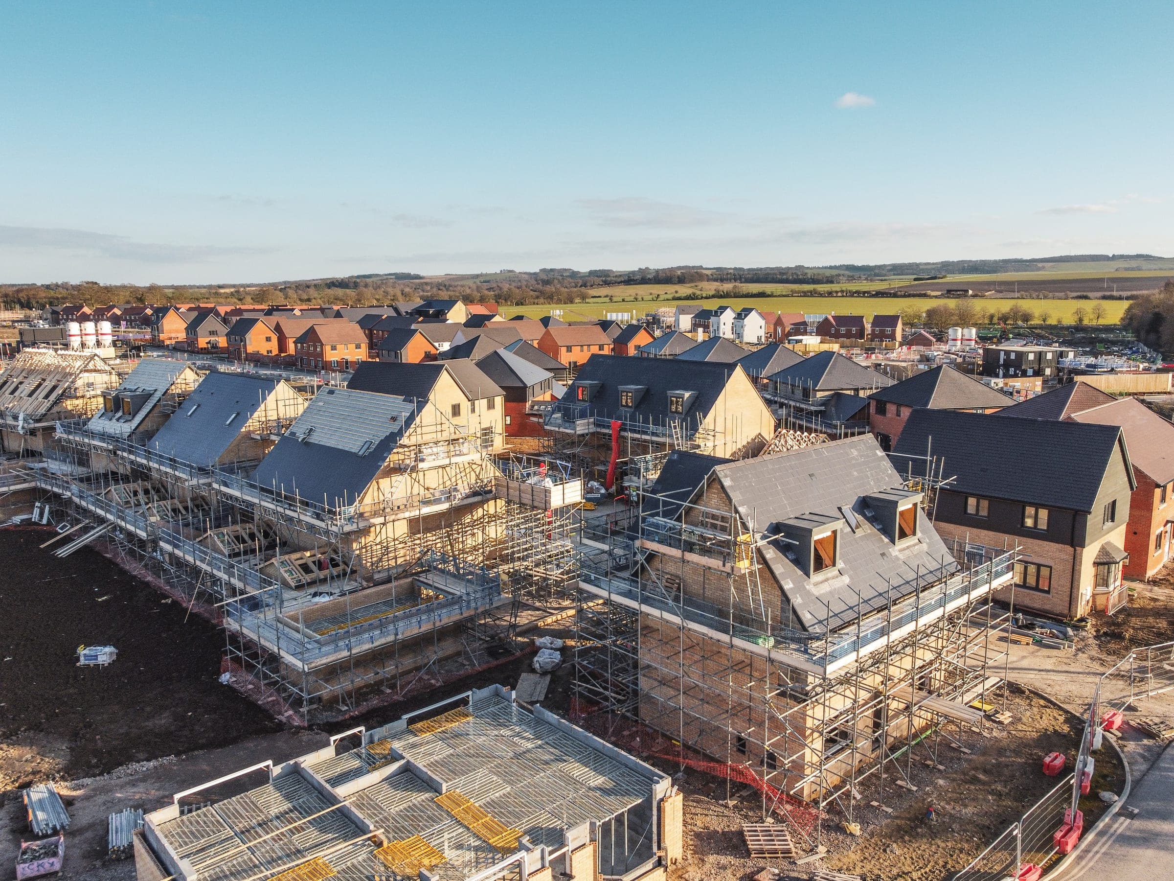 Aerial view of a residential estate under renovation with scaffolding