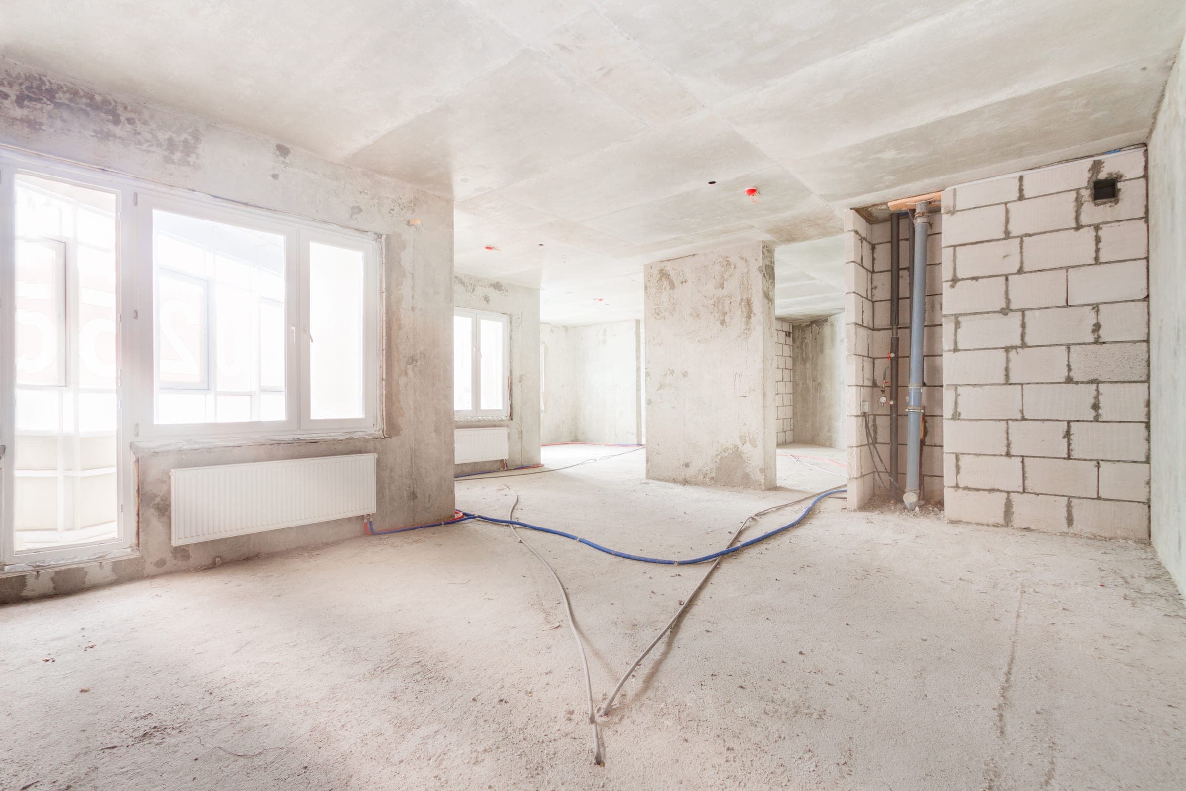 Interior under renovation with new windows before plastering